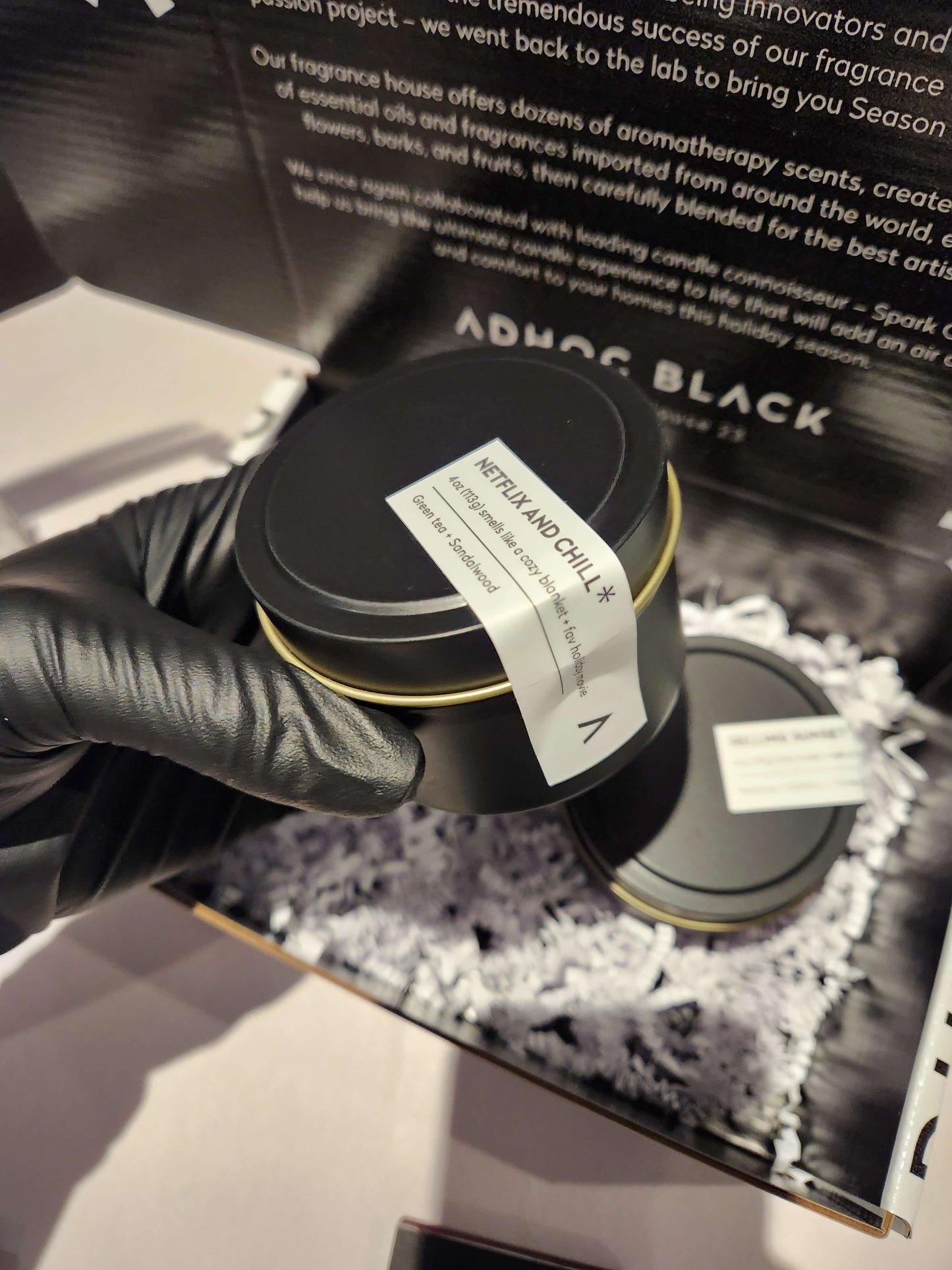 Black custom candle tin with a label in a 2-pack custom mailer box for a special event