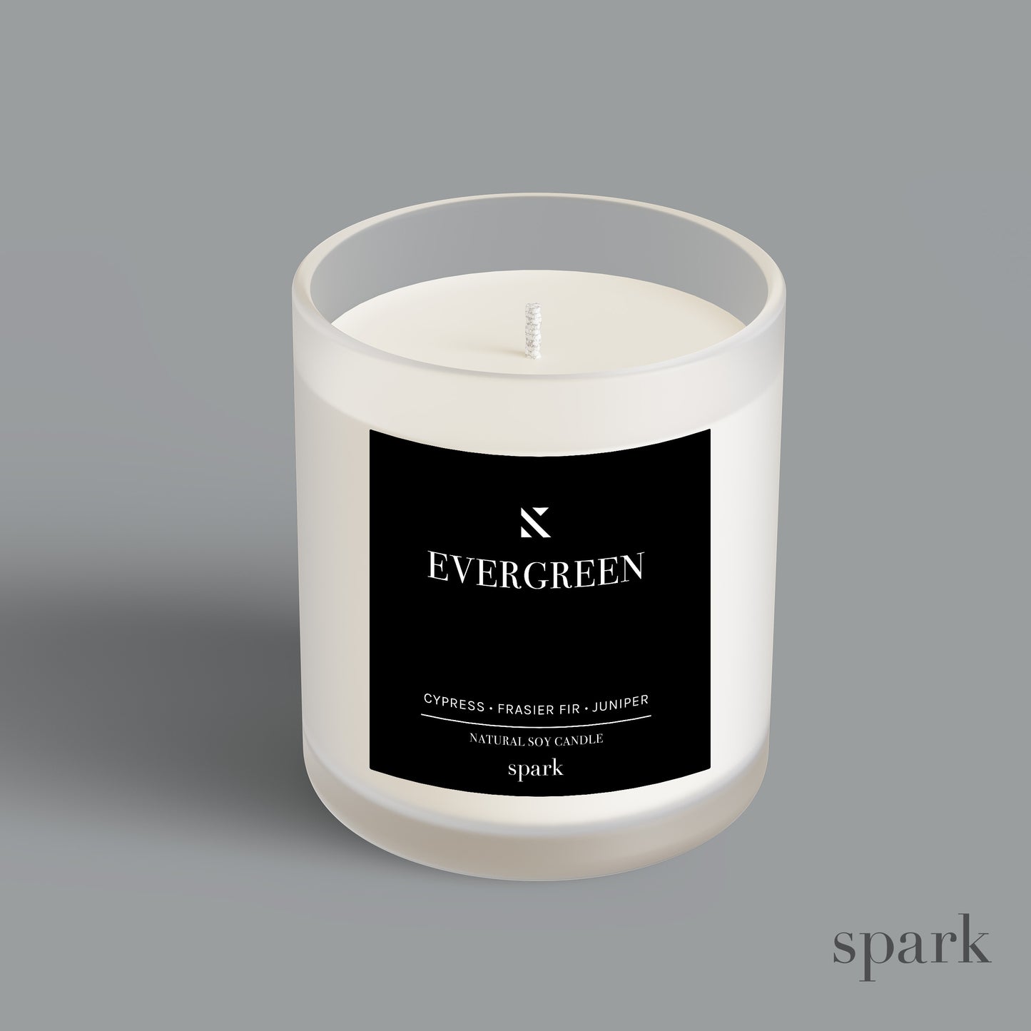 Custom branded frosted clear glass candle produced by a candle manufacturer for corporate gifts and events.