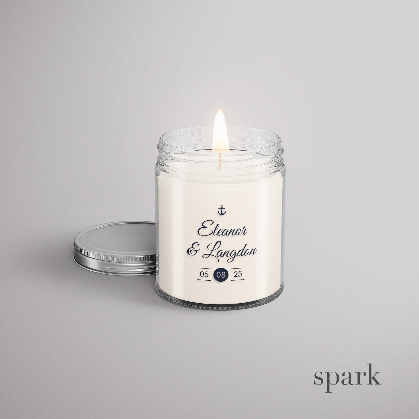 Custom wedding candle with bride and groom names and event date in 4oz clear glass style with silver lid