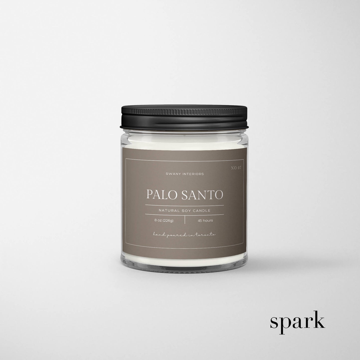 Front view of custom 8oz clear glass candle featuring a vibrant full-color label.