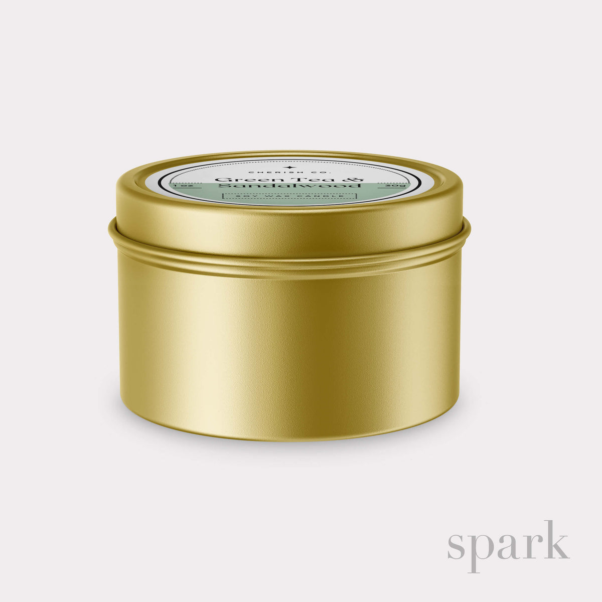 Gold candle tin with a label on a light gray background