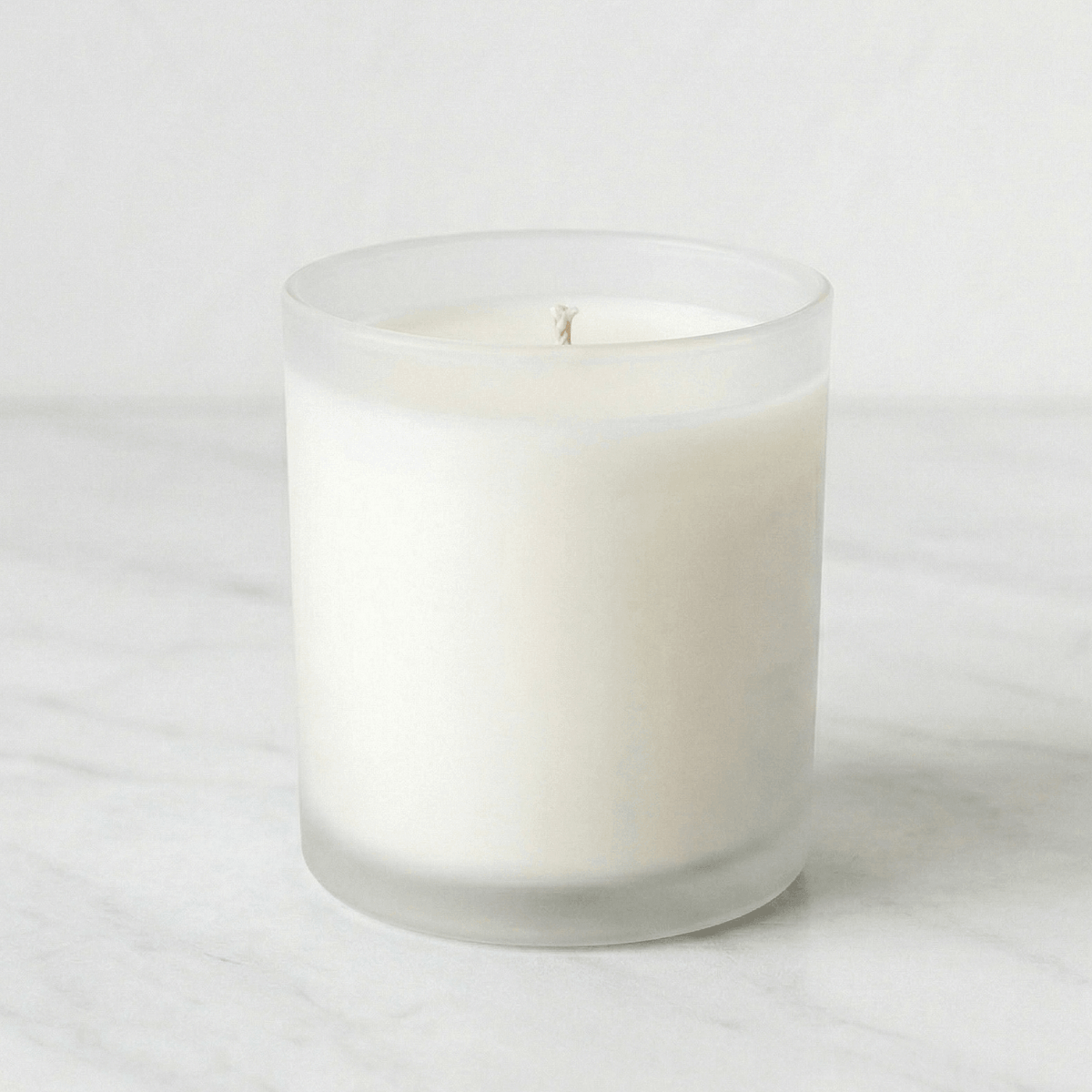 10oz frosted clear unbranded candle in a glass container on a white background